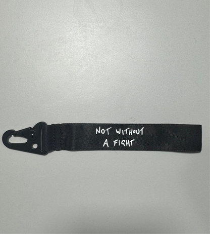 Daniel Ricciardo “Not without a fight” inspired wristlet keychain.