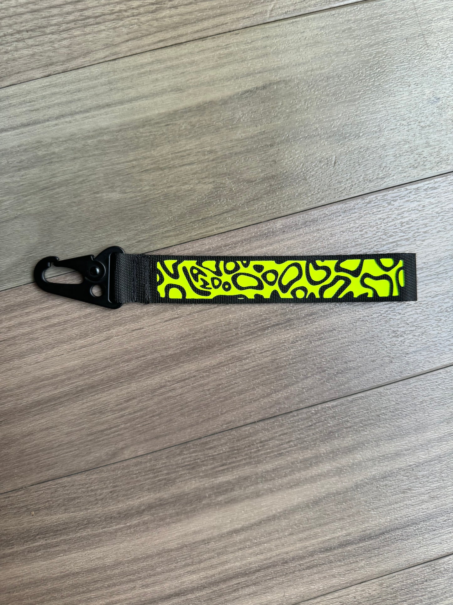 Lando Norris helmet inspired wristlet keychain.