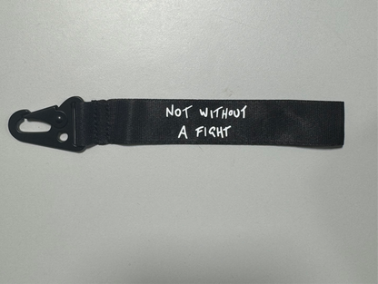 Daniel Ricciardo “Not without a fight” inspired wristlet keychain.